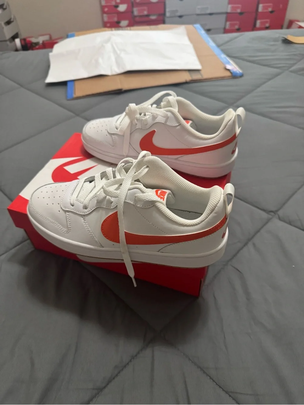 Nike Kids White Sneakers with Orange Swoosh